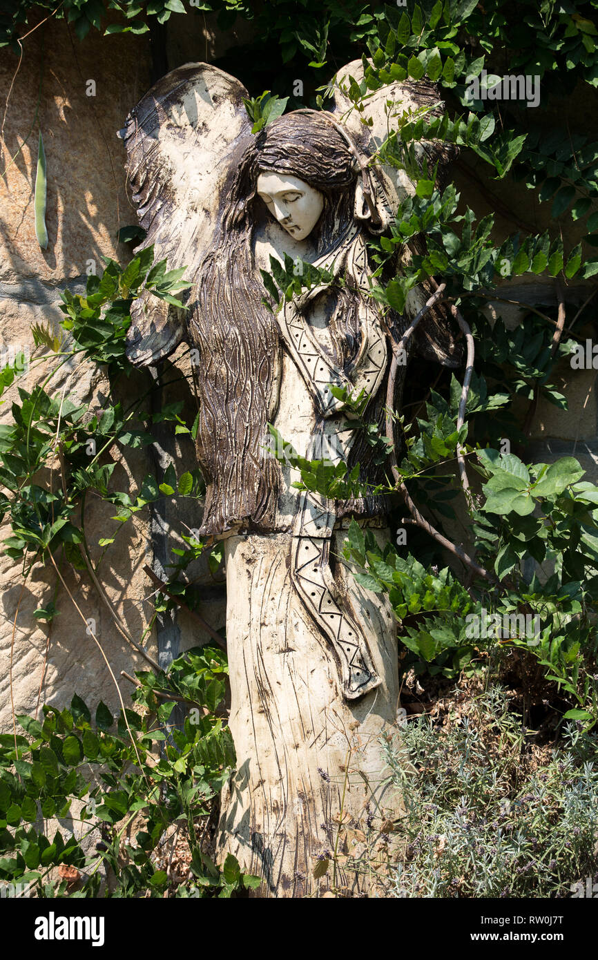 Carved wooden statue of angel Stock Photo - Alamy