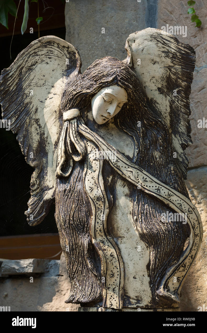 Carved wooden statue of angel Stock Photo - Alamy