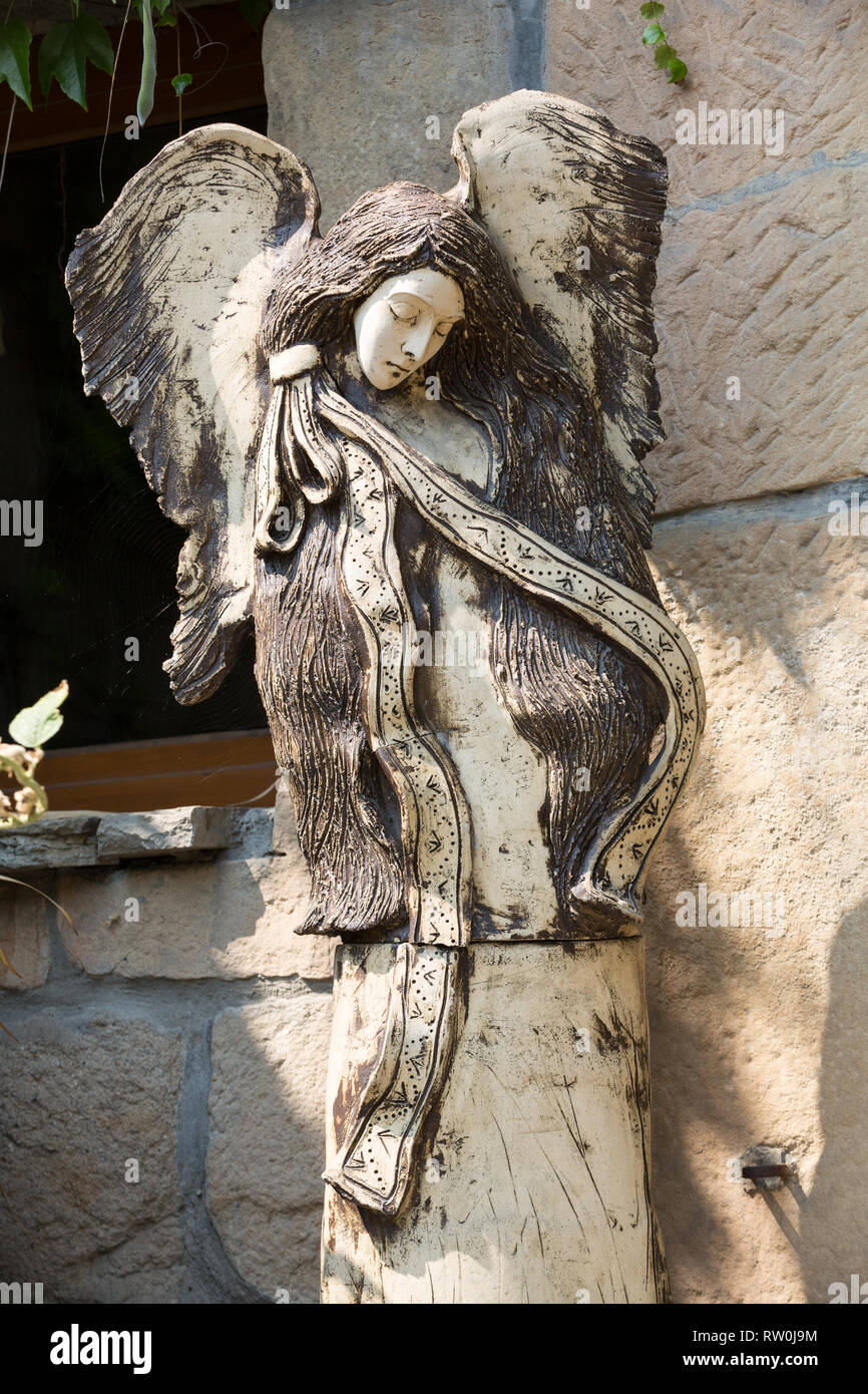 Carved wooden statue of angel Stock Photo Alamy