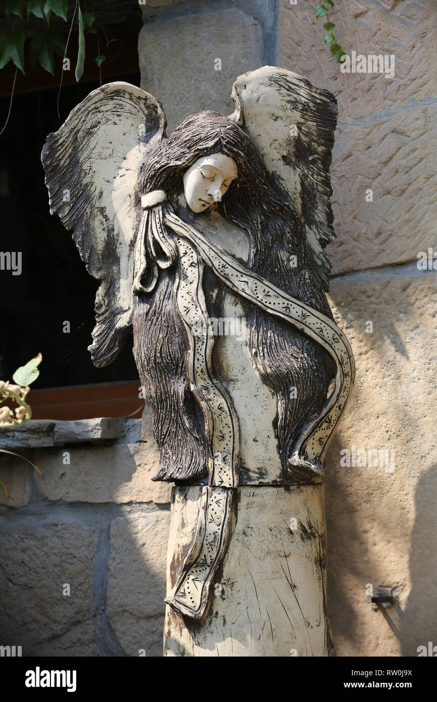 Carved wooden statue of angel Stock Photo - Alamy