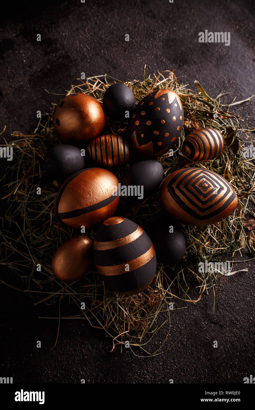 Easter composition with black and gold decorative Easter eggs Stock Photo