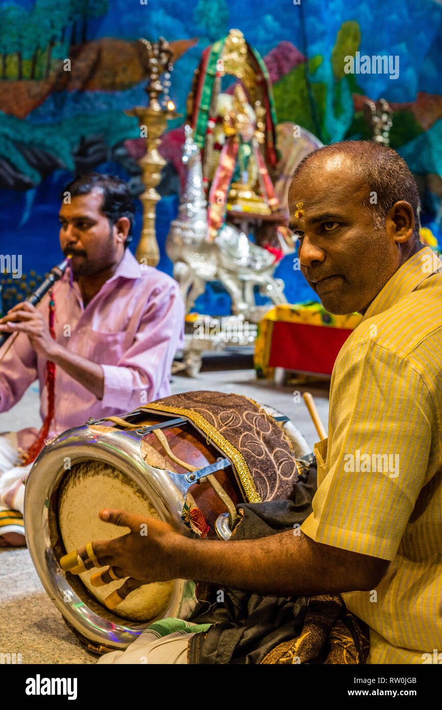 Batu Caves, Musician Playing a Thavil, a South Indian Drum, Selangor, Malaysia. Stock Photo