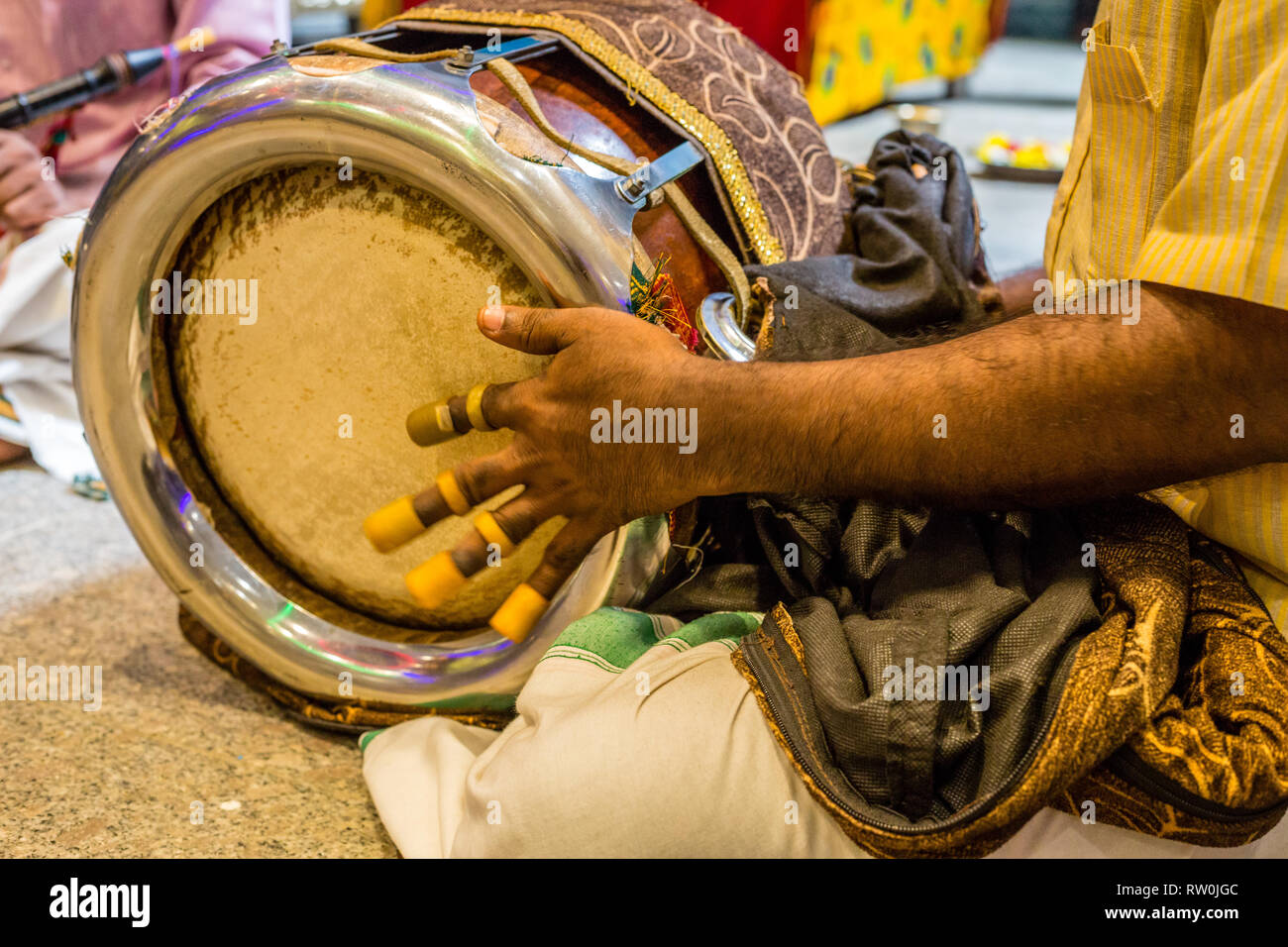 Batu Caves, Musician Playing a Thavil, a South Indian Drum, Selangor, Malaysia. Stock Photo