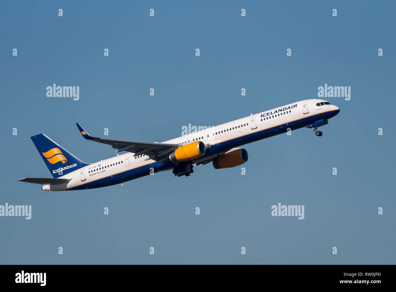 Icelandair Boeing 757 jet airliner plane TF-FIX taking off from London Heathrow Airport, UK, in blue sky. Space for copy Stock Photo