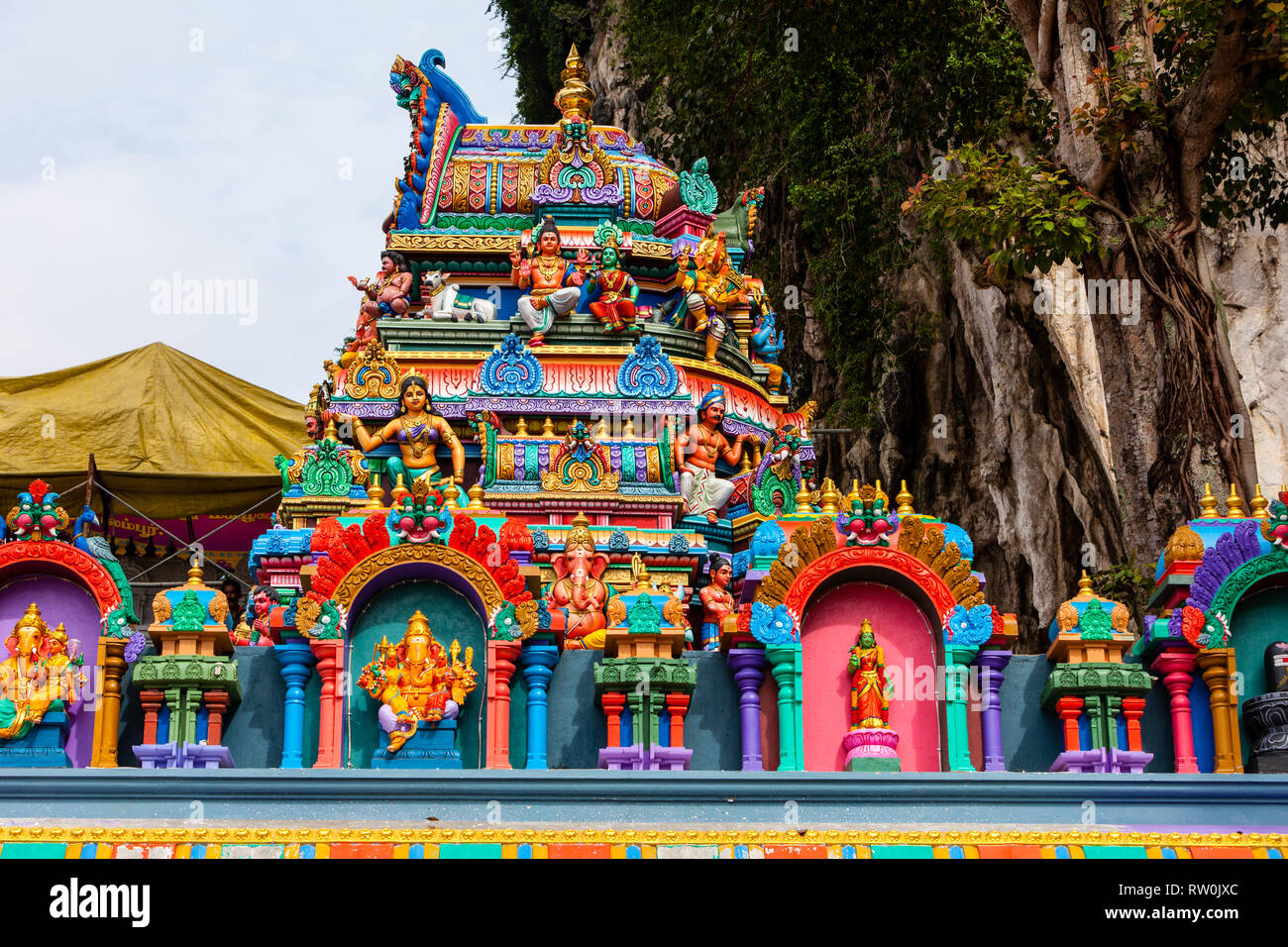 Batu Caves, Hindu Deities on Temple at Base of Stairs leading to Caves, Selangor, Malaysia. Stock Photo