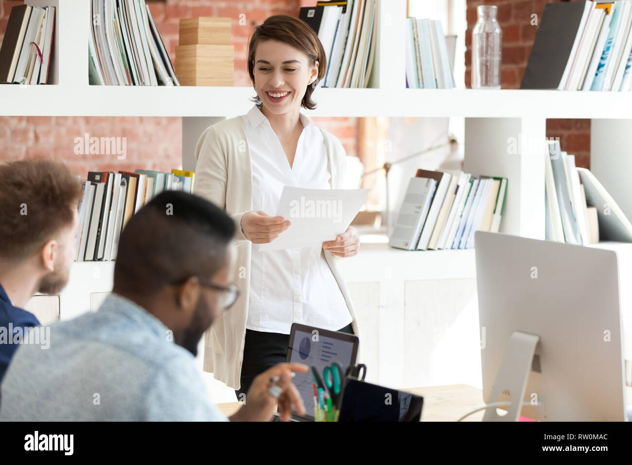 Diverse young professionals working together in modern office Stock Photo