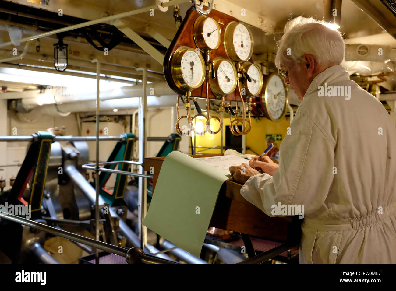 Engineer, in engine room, on , Paddle Steamer, Waverley, trip, round, the , Isle of Wight, England, UK, Stock Photo