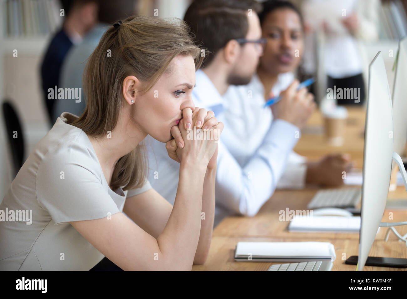 Woman employee having problem and doubts about business moments Stock Photo