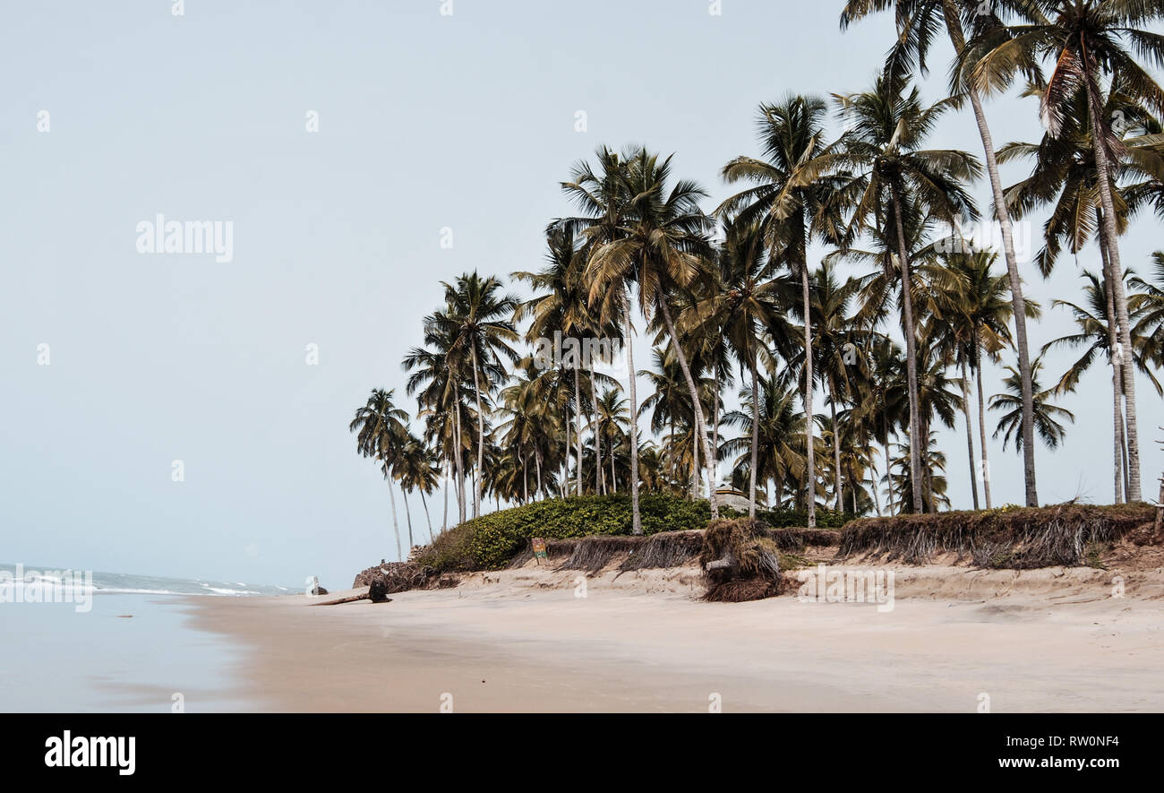 A nice landscape photo of a beautiful tropical sandy beach near the town of Elmina, Ghana, West Africa Stock Photo