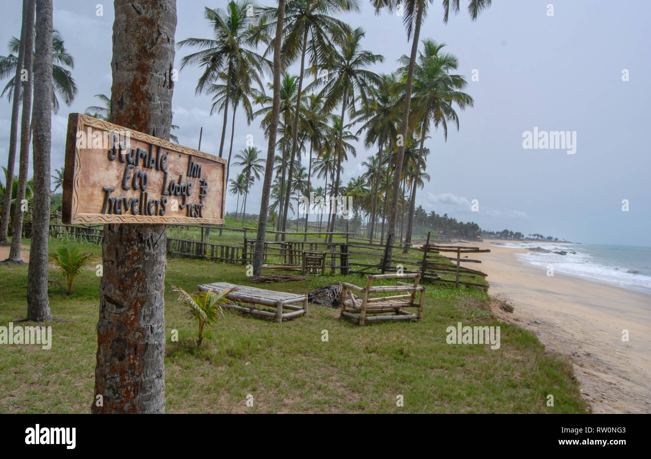 A welcome sign to the stumble Inn Eco lodge at the tropical town of Elmina, Ghana. Stock Photo