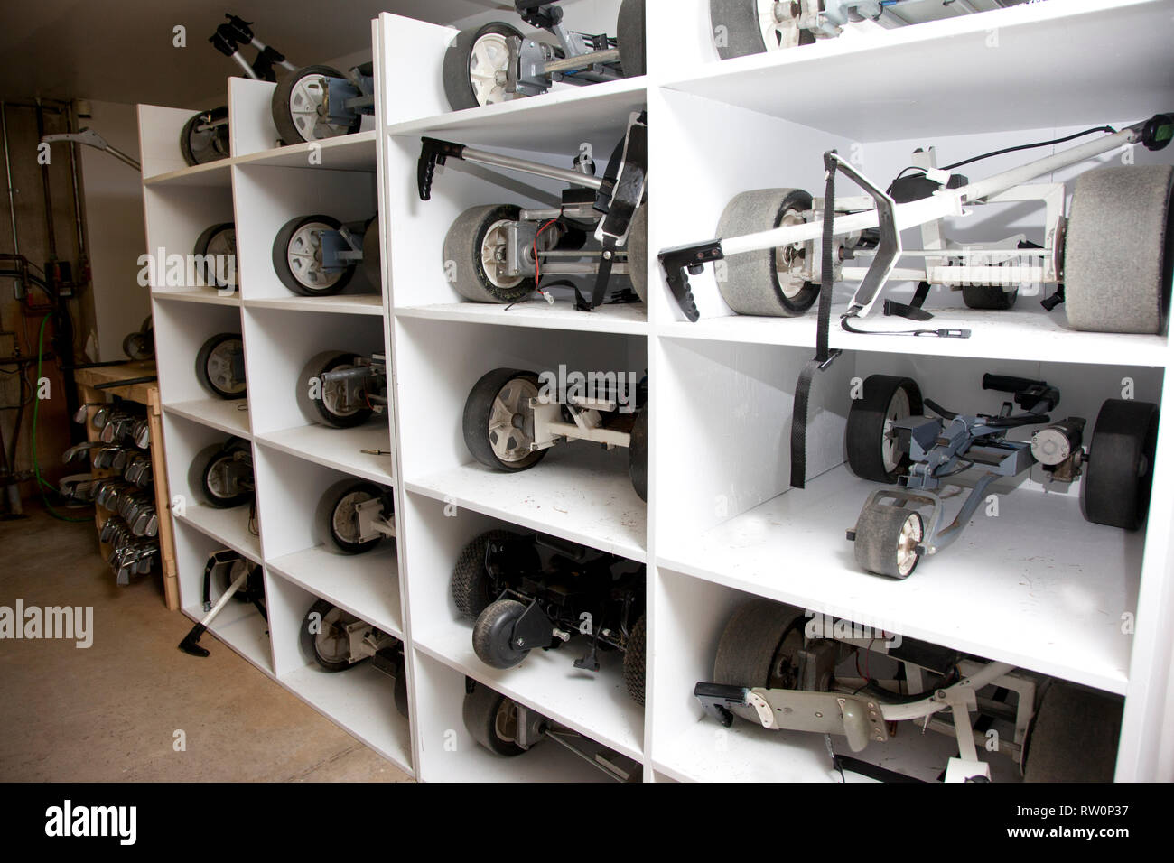 Lockers with golf push and pull carts being stored for golfers Stock