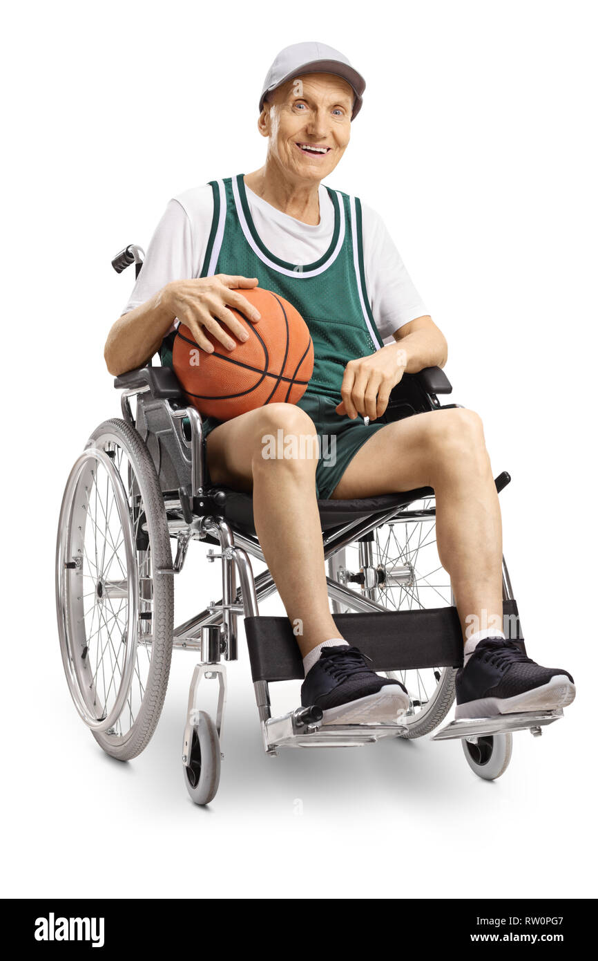 Senior disabled man holding a basketball and sitting in a wheelchair isolated on white background Stock Photo