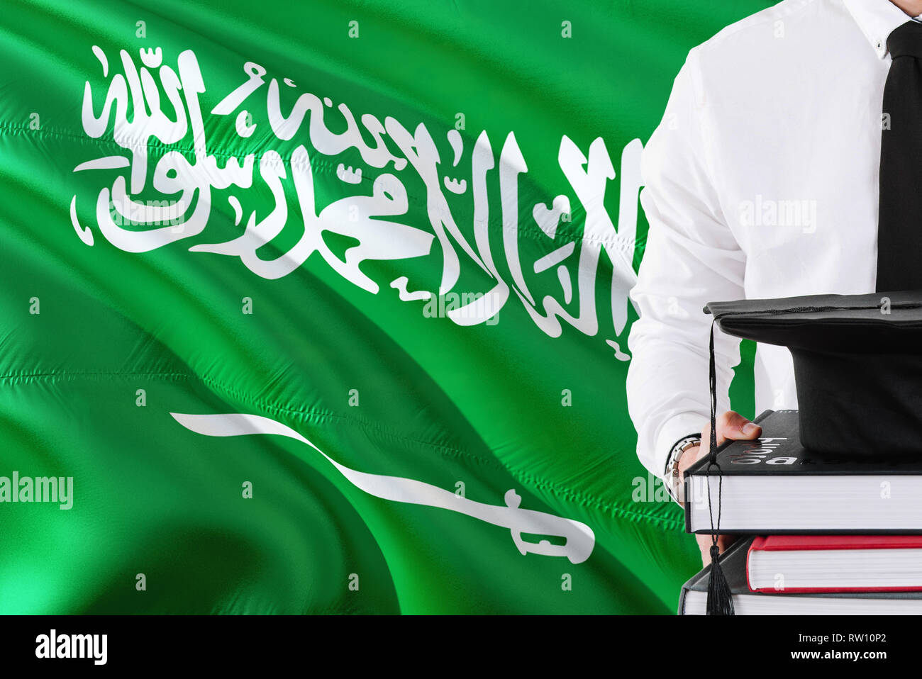 Successful Saudi student education concept. Holding books and