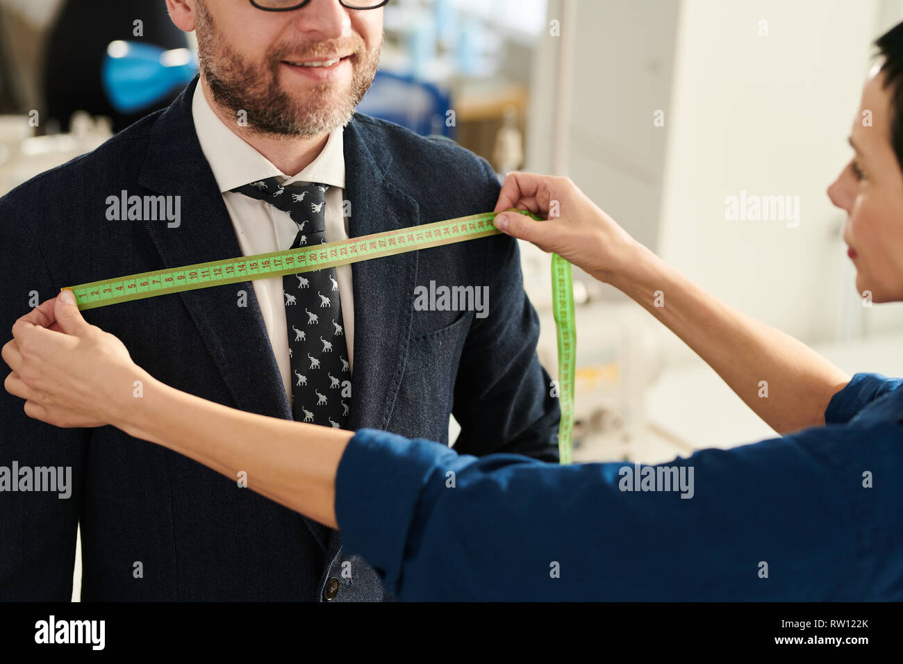 Tailor working with client Stock Photo