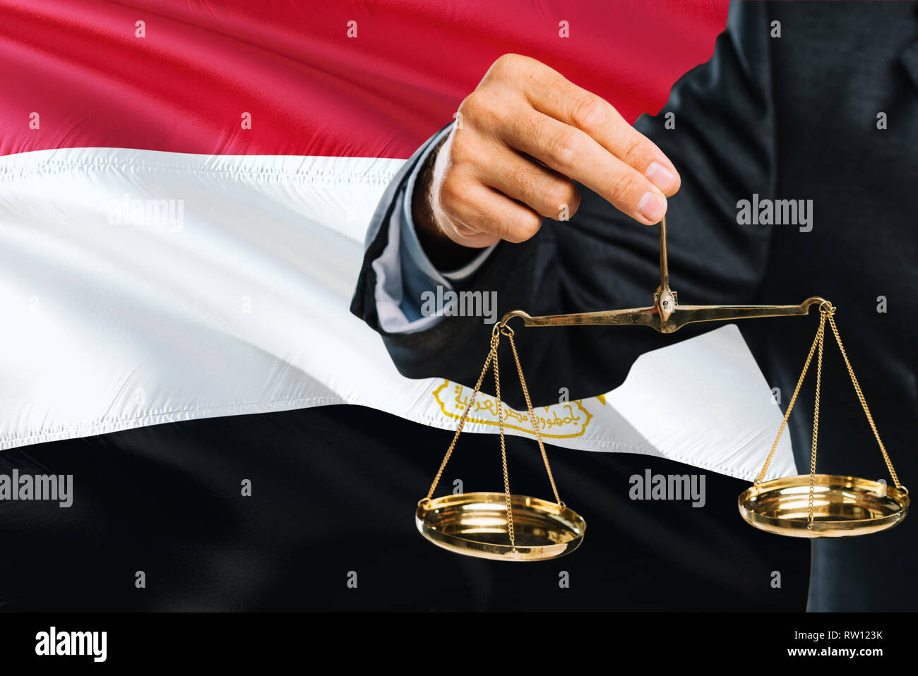 Egyptian Judge is holding golden scales of justice with Egypt waving