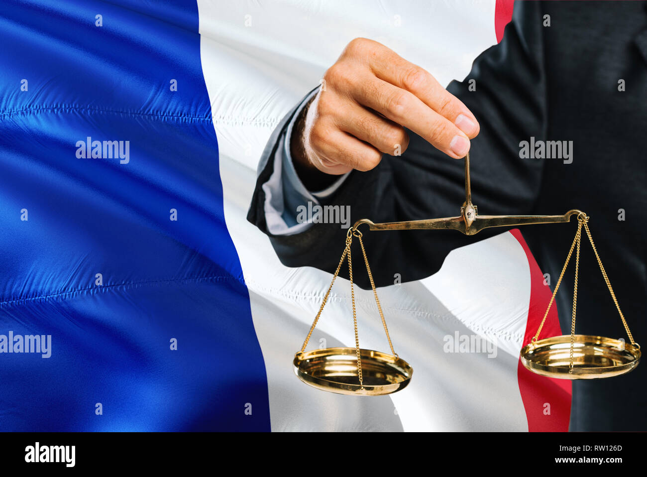 French Judge is holding golden scales of justice with France waving