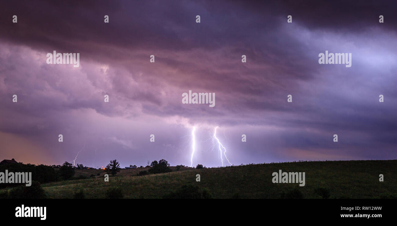 Multiple lightning bolts during nighttime thunderstorm in Kentucky Stock Photo