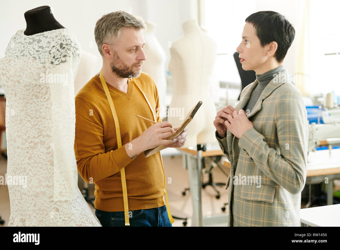 Woman tailor designer suit hi-res stock photography and images - Alamy