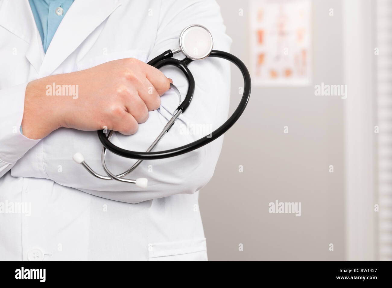 Close-up of a male doctor holding stethoscope in the office Stock Photo ...