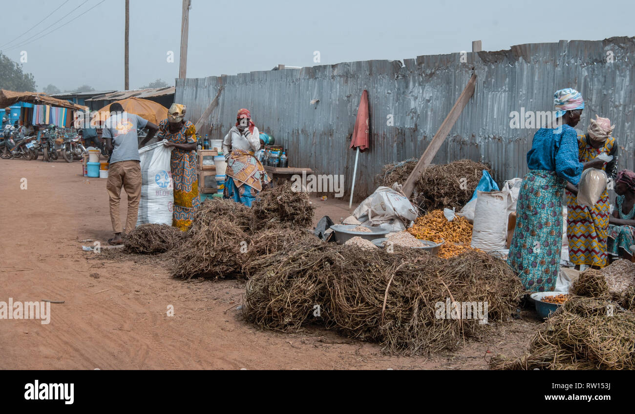 A photo of vendors selling various materials at a dirty street in Bolgatanga, Ghana Stock Photo