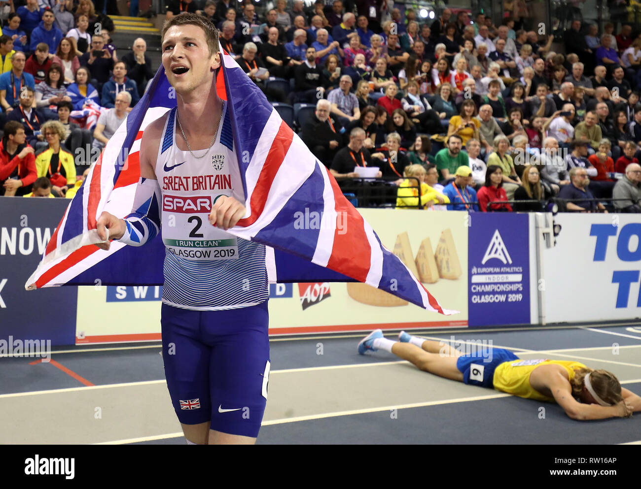 Great Britain's Tim Duckworth (left) celebrates winning silver at the Men's Heptathlon as Sweden's Fredrik Samuelsson finished fourth during day three of the European Indoor Athletics Championships at the Emirates Arena, Glasgow. Stock Photo