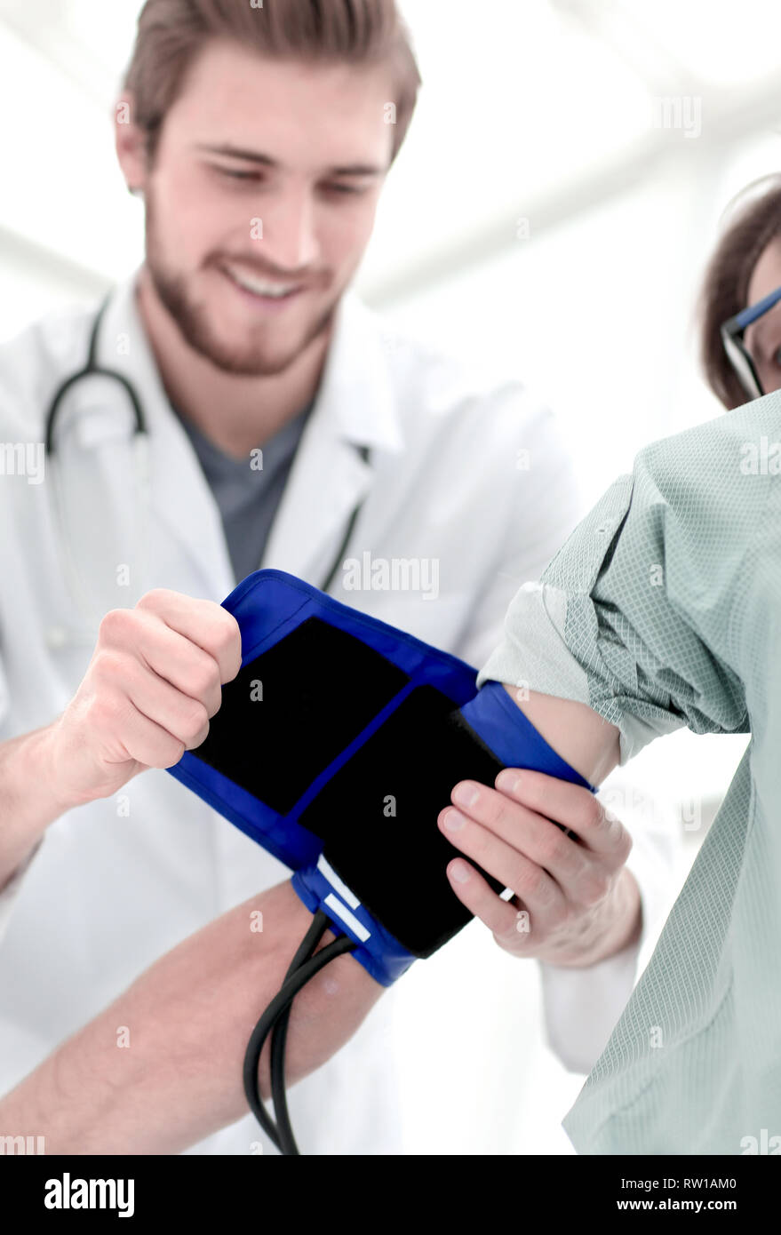Visit man blood pressure measurement hi-res stock photography and ...