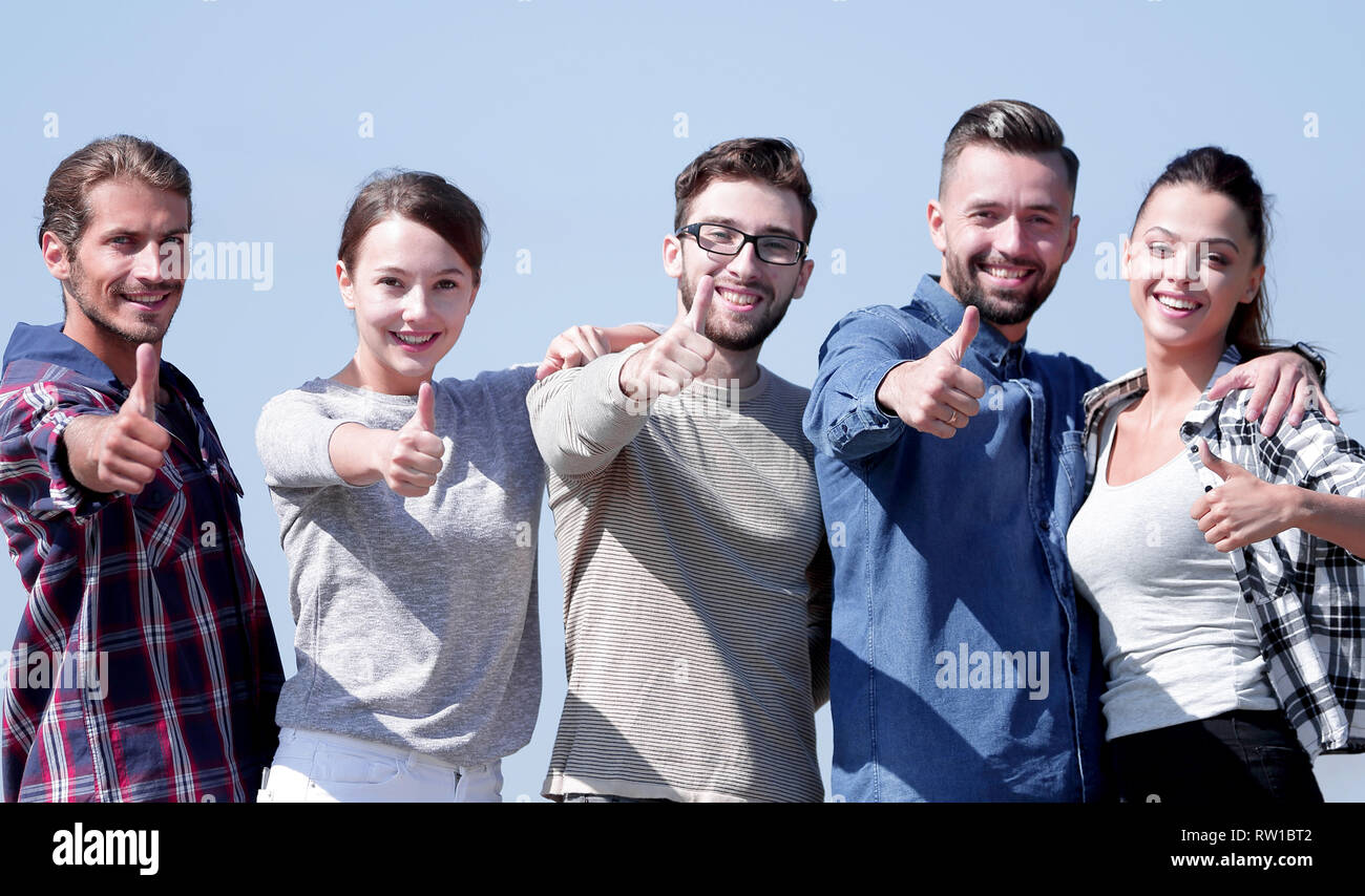 group of young people showing thumb up Stock Photo - Alamy
