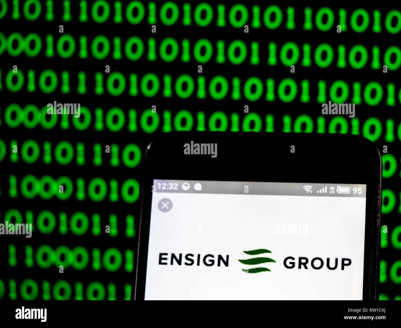 The Ensign Group, Inc. logo seen displayed on smart phone Stock Photo
