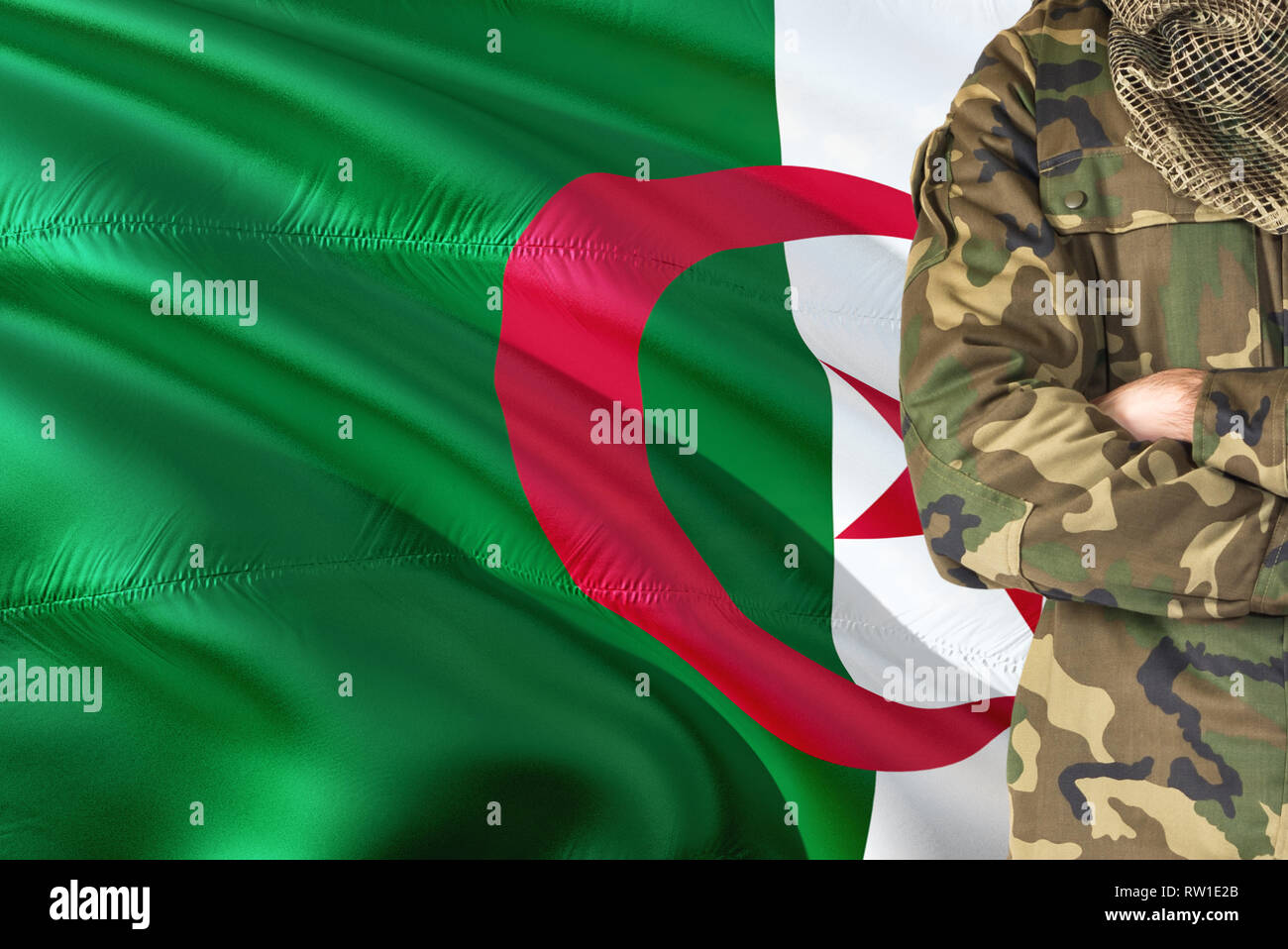 Crossed arms Algerian soldier with national waving flag on background -  Algeria Military theme Stock Photo - Alamy