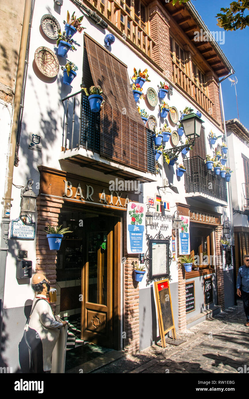 A restaurant in the Albaicin neighborhood of Granada, Spain, known for it's abundant use of plates on its front facade. Stock Photo