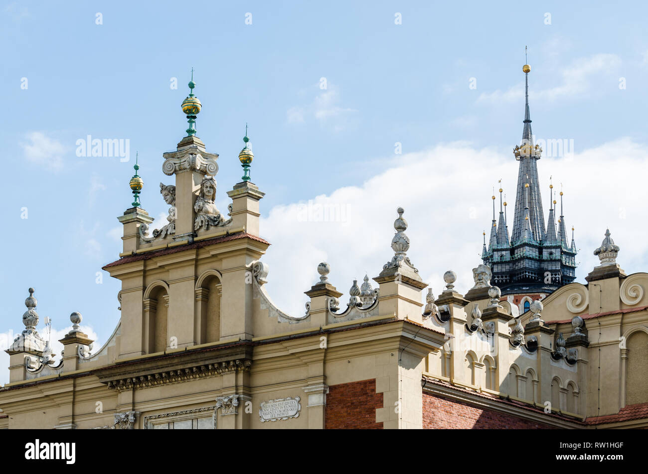 Architectural details of cloth hall and St. Mary's Basilica tower, Main Square, Old Town, Krakow, Poland Stock Photo