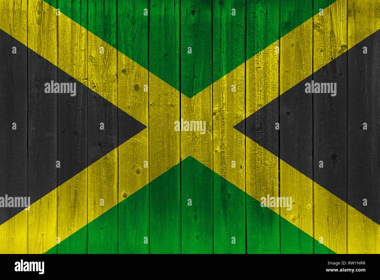 Jamaica flag painted on old wood plank. Patriotic background. National flag of Jamaica Stock Photo