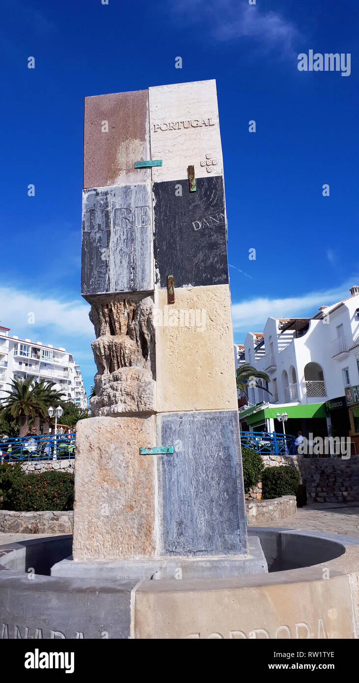 Tall column on the espanade in nerja, made of different local stones
