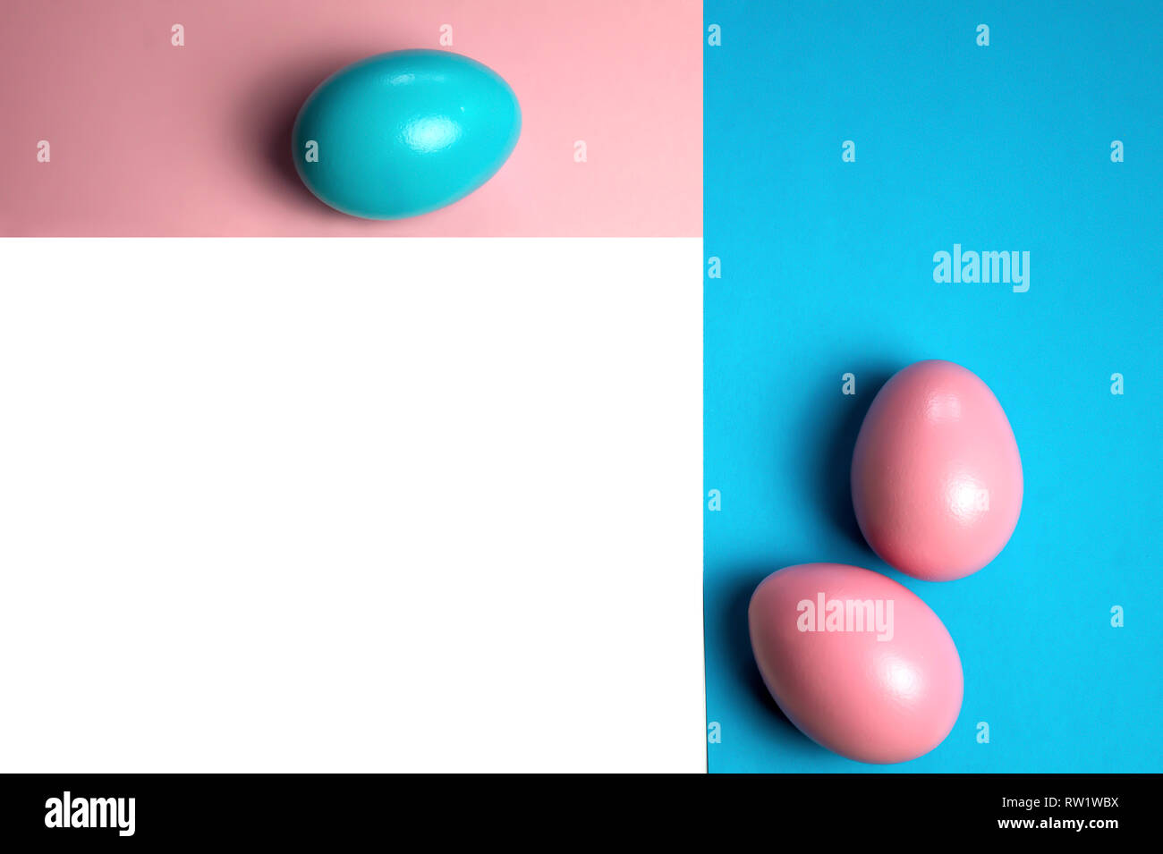 Creative minimalist layout made of eggs and color block background. Flat lay. Easter concept frameing pink blue Stock Photo