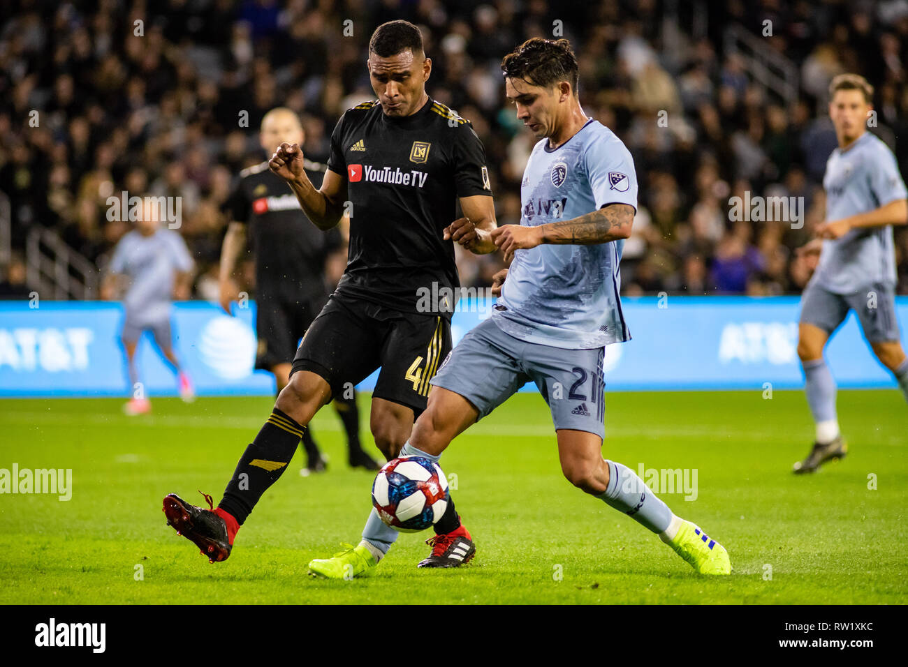 Los Angeles, USA. 3rd March, 2019. Felipe Gutierrez (21) of Sporting KC against LAFC's Eddie Segura (4). Credit: Ben Nichols/Alamy Live News Stock Photo