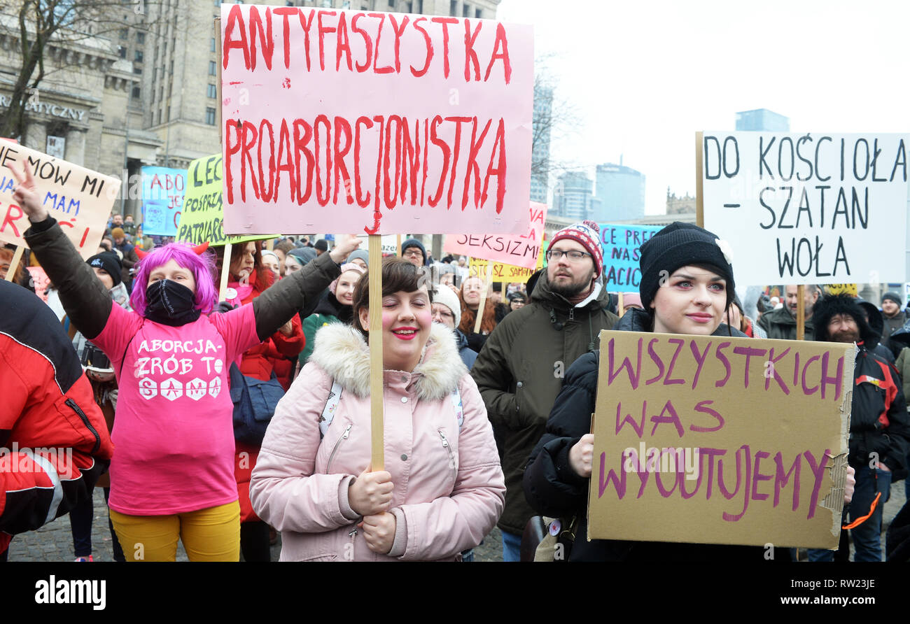 20th Manifa organised by Porozumienie Kobiet 8 Marca, an informal and independent group demanding the equalization for women and correction of Polish law discriminating women, entitled We’re the revolution - 'The law protects the perpetrators', 'We are afraid to ask for help' walks through the streets on March 3, 2019 in Warsaw, Poland.  The banner reads: Anti- fascist and Pro-abortionist Stock Photo