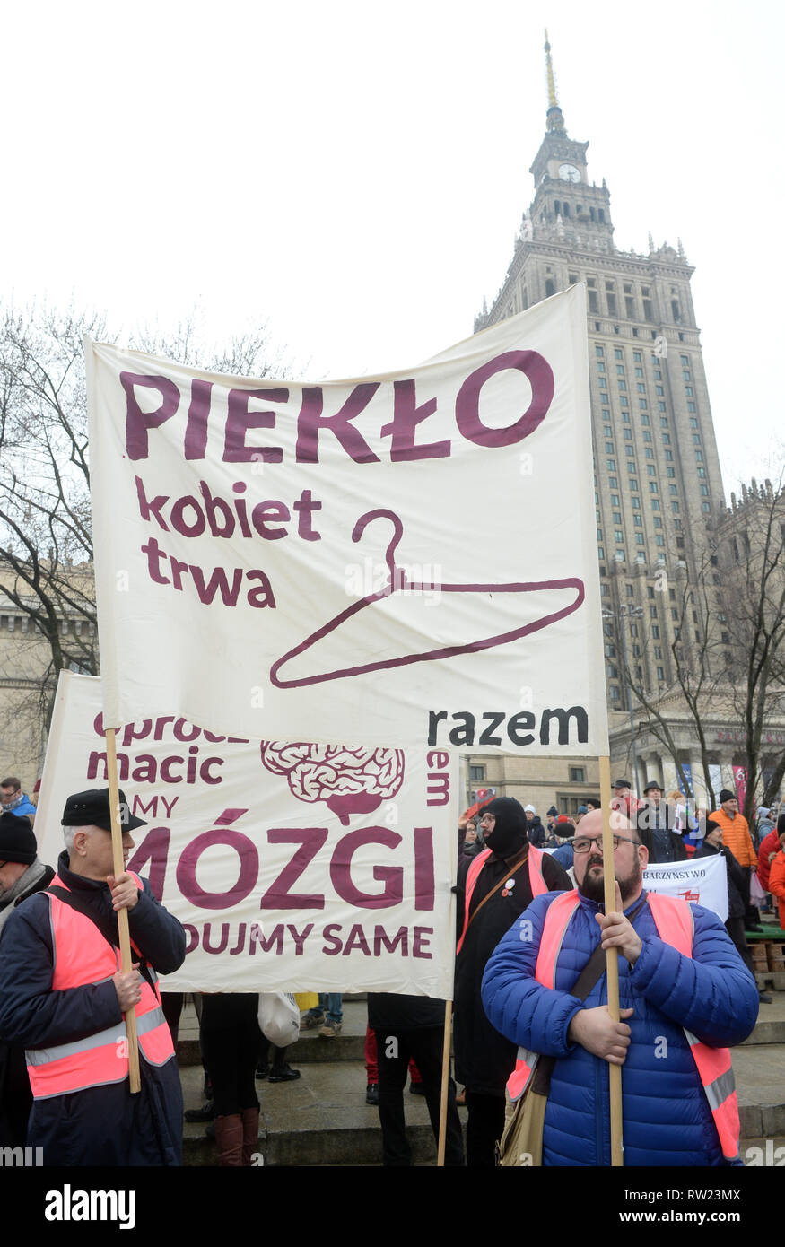 20th Manifa organised by Porozumienie Kobiet 8 Marca, an informal and independent group demanding the equalization for women and correction of Polish law discriminating women, entitled We’re the revolution - 'The law protects the perpetrators', 'We are afraid to ask for help' walks through the streets on March 3, 2019 in Warsaw, Poland. Stock Photo
