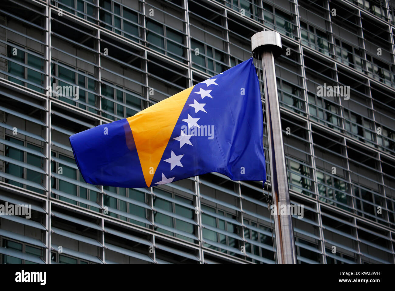 Brussels, Belgium. 4th March 2019. Flags of European Union and the Bosnia and Herzegovina wave outside of the European Commission. Alexandros Michailidis/Alamy Live News Stock Photo