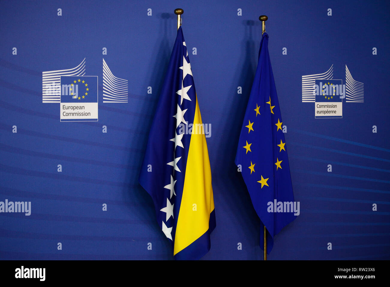 Brussels, Belgium. 4th March 2019. Flags of European Union and the Bosnia and Herzegovina wave outside of the European Commission. Alexandros Michailidis/Alamy Live News Stock Photo