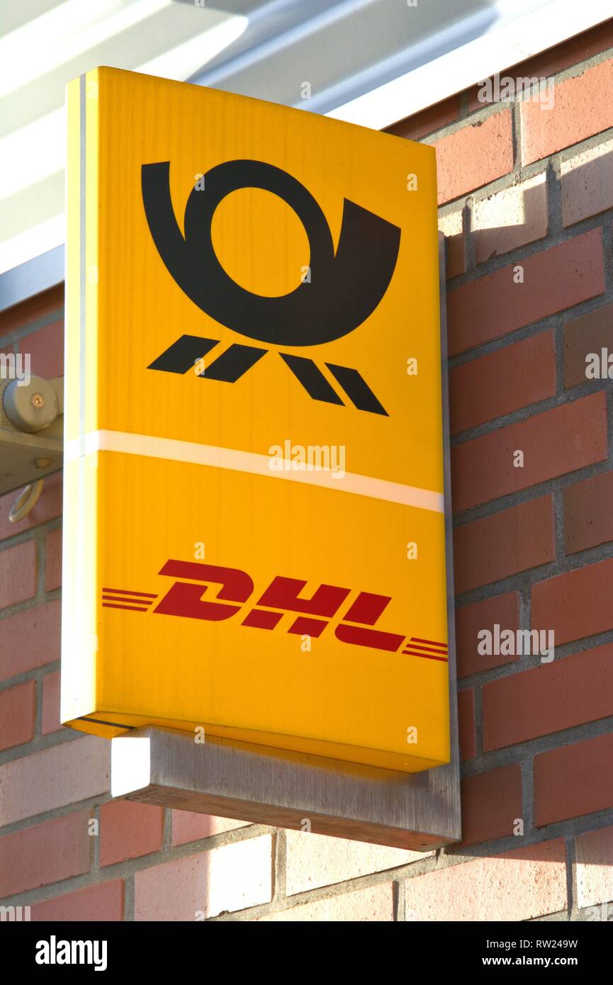 Schleswig, Deutschland. 01st Jan, 2019. The illuminated sign of a DHL parcel shop with post office in Schleswig. Deutsche Post AG offers a store network for many retailers via shop-in-shop solutions, which it was unable to operate on its own. --- For editorial use only --- Only for editorial use! | usage worldwide Credit: dpa/Alamy Live News Stock Photo