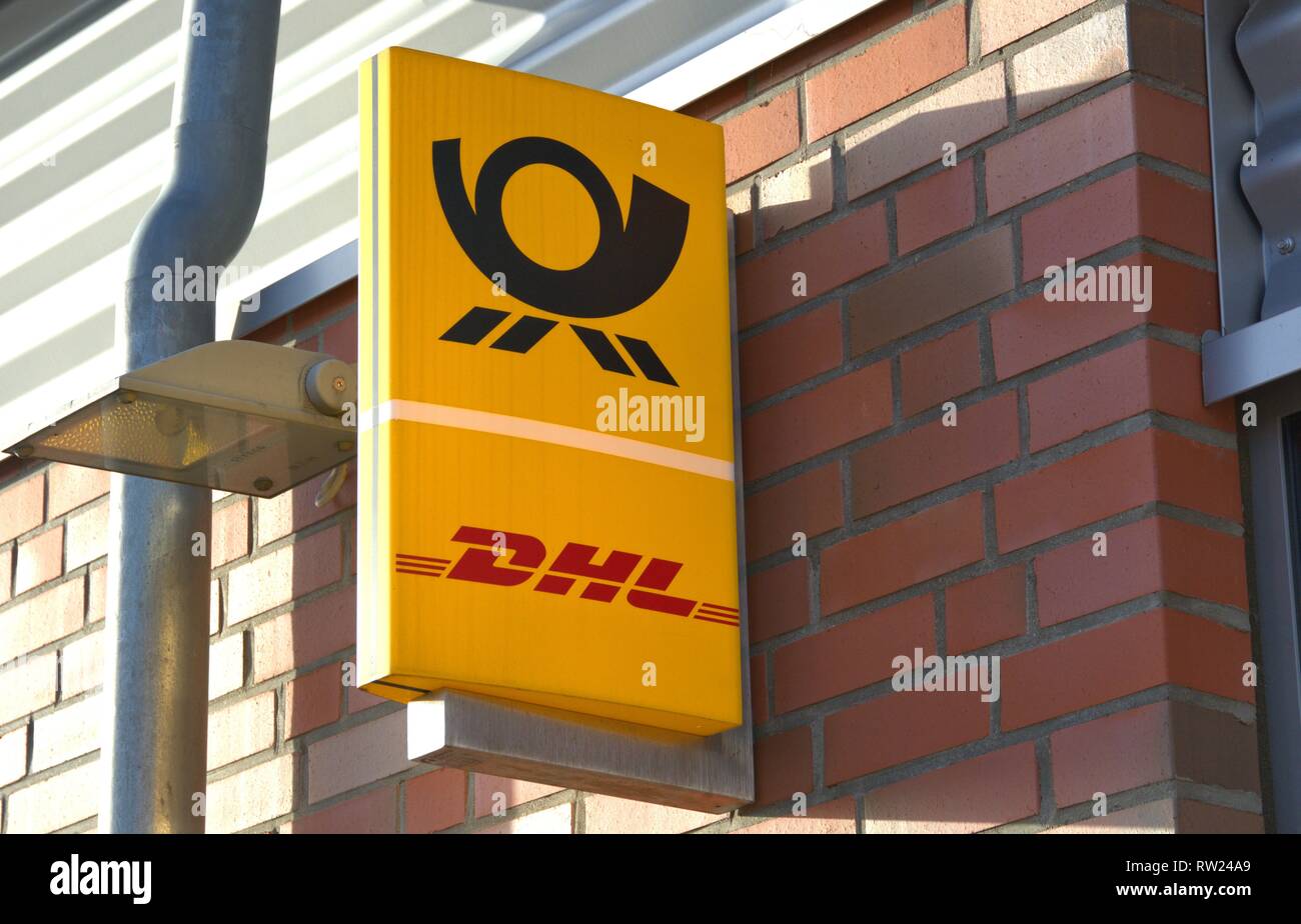 Schleswig, Deutschland. 01st Jan, 2019. The illuminated sign of a DHL parcel shop with post office in Schleswig. Deutsche Post AG offers a store network for many retailers via shop-in-shop solutions, which it was unable to operate on its own. --- For editorial use only --- Only for editorial use! | usage worldwide Credit: dpa/Alamy Live News Stock Photo