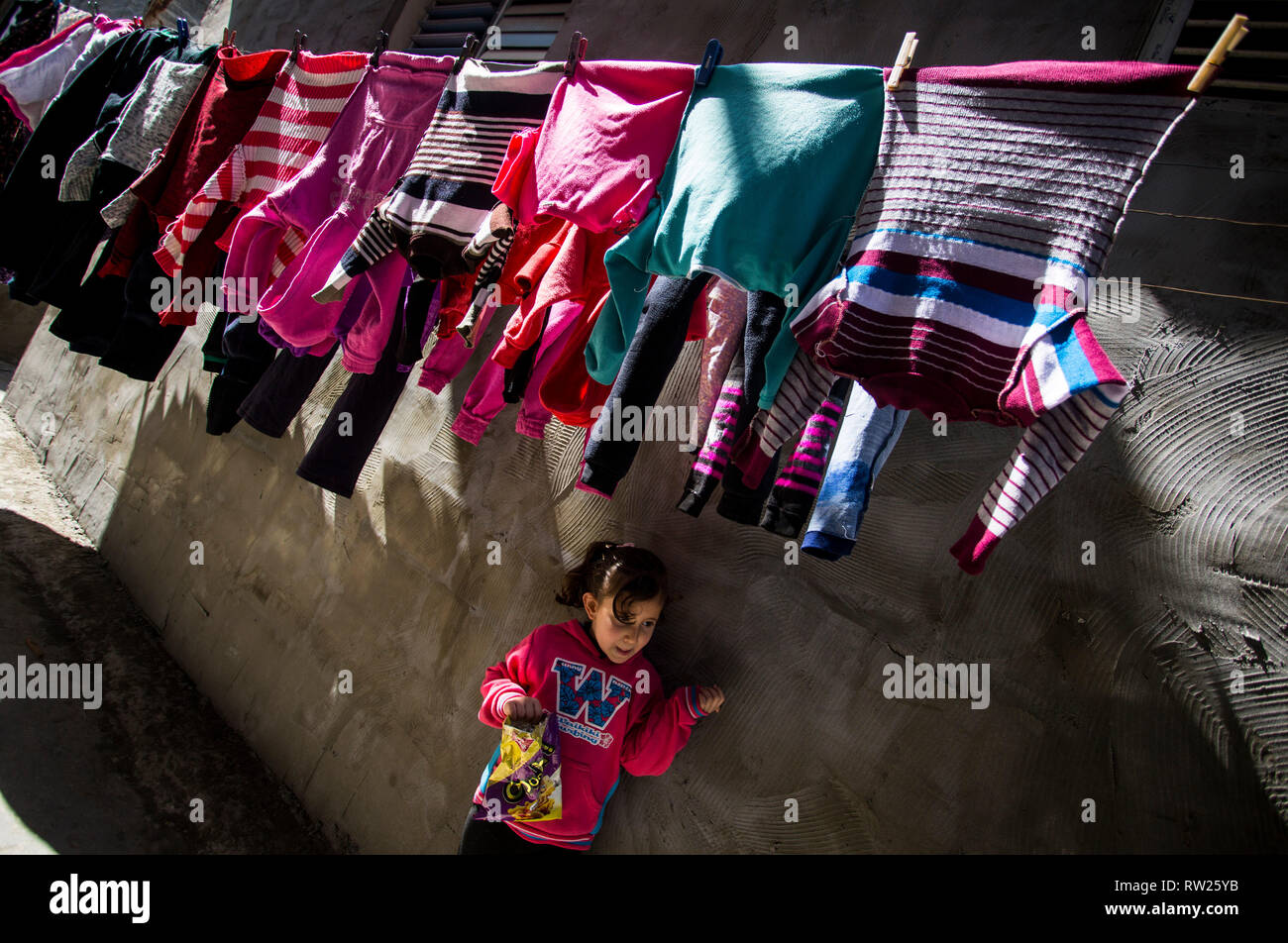 Gaza, Palestine. 4th Mar 2019. A Palestinian girl seen standing near their house at the Jabalya refugee camp in the northern Gaza Strip. With high rates of unemployment and lack of job opportunities in Gaza, an increasing number of families are facing poverty after losing work during the last 12-year blockade on Gaza. Credit: SOPA Images Limited/Alamy Live News Stock Photo