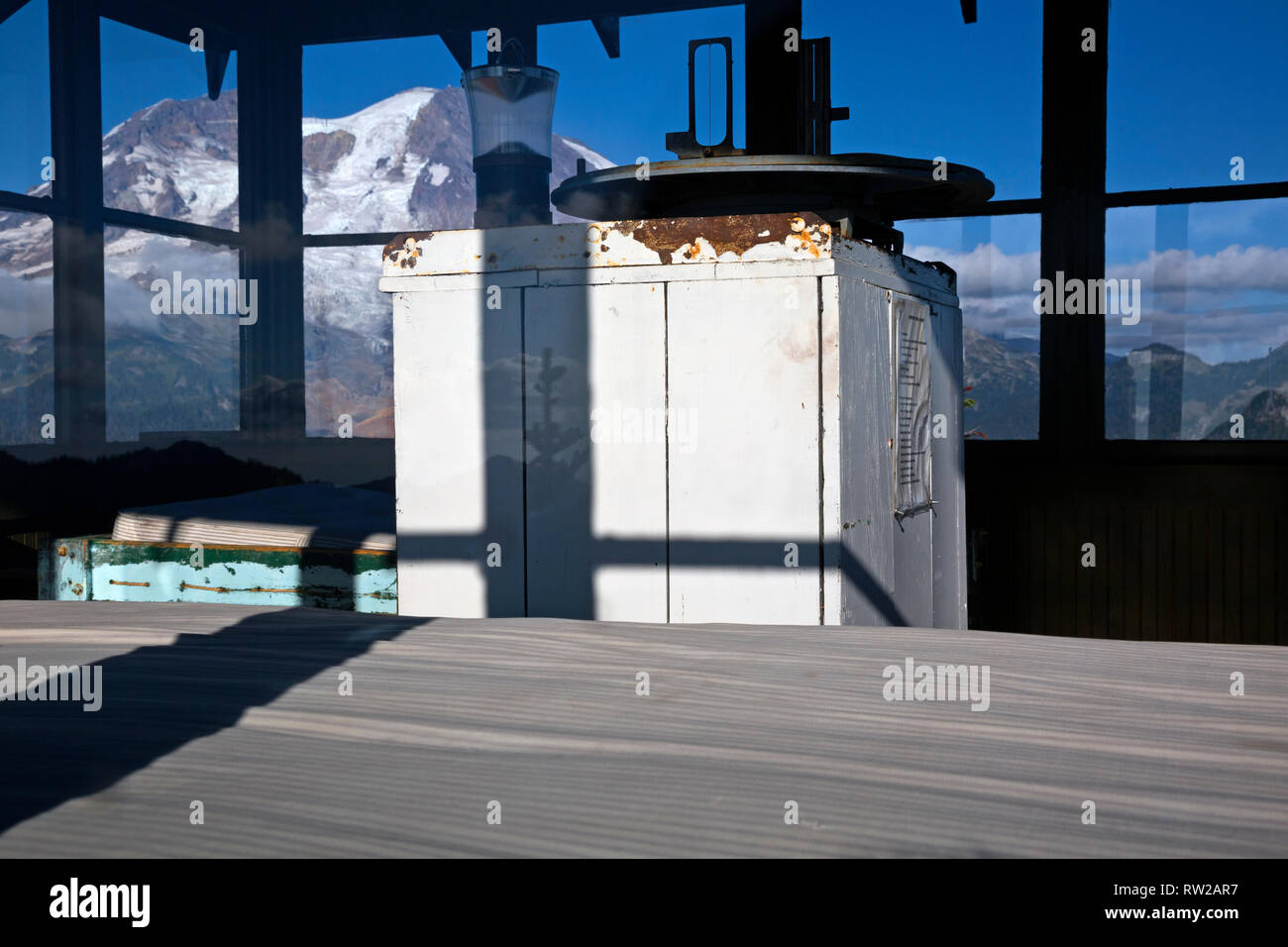 WA15857-00...WASHINGTON - View of the old fire finder on the inside of the Gobblers Knob Fire Lookout and Mount Rainier beyond in Mount Rainier Nation Stock Photo