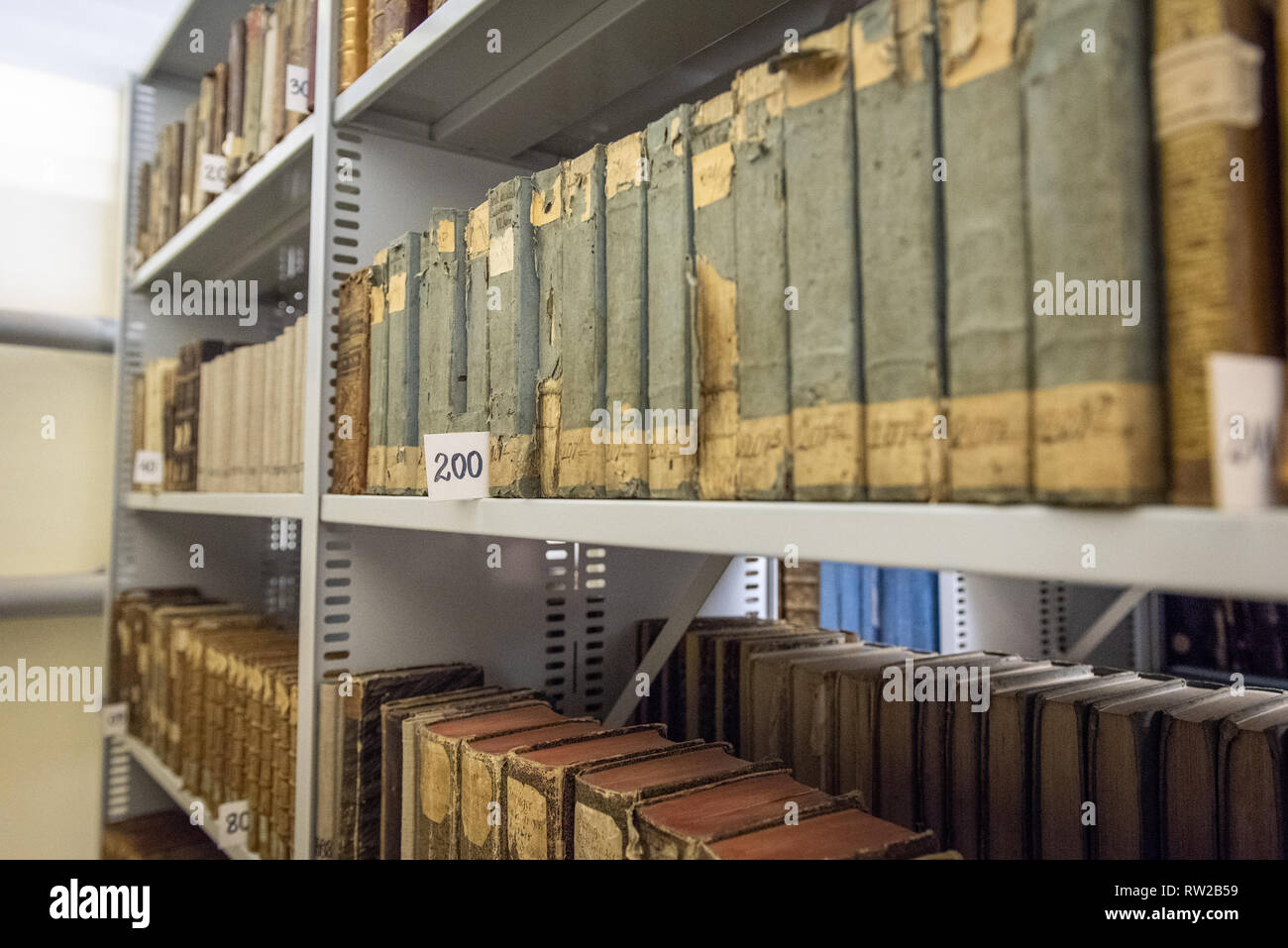 Several collections of older and original books sit organized by call number on library shelves. Central Agricultural Library, Warsaw, Masovian Voivod Stock Photo