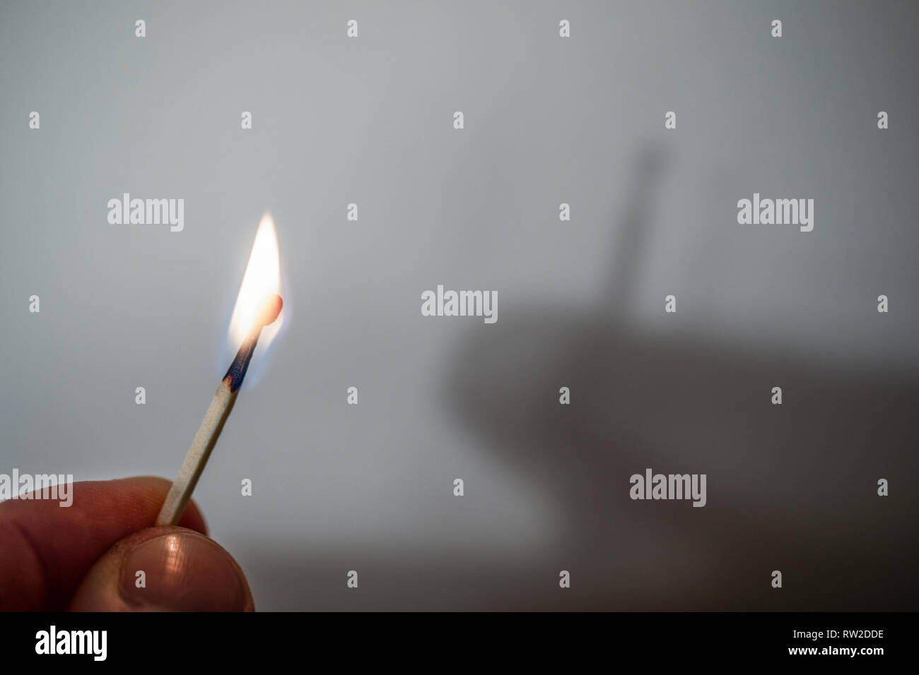 Fire match not throwing a shadow. Play of light and shade Experiment