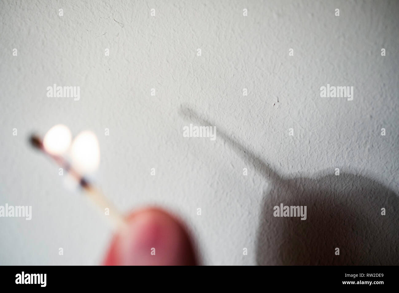 Fire match not throwing a shadow. Play of light and shade Experiment