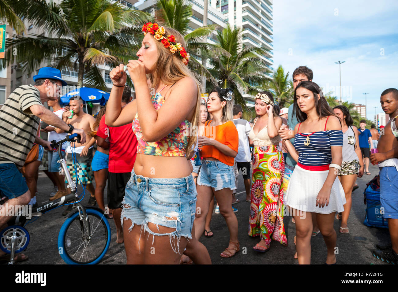 RIO DE JANEIRO - JANUARY 30, 2016: An afternoon banda street party in Ipanema draws crowds of young Brazilians during the city's Carnival celebrations Stock Photo