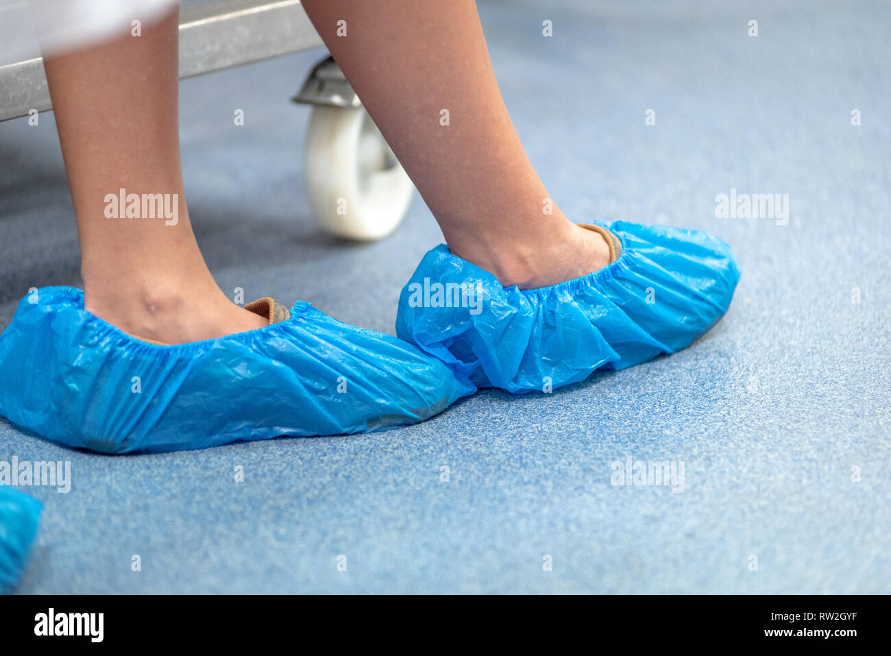 Disposable shoe covers hi res stock photography and images Alamy