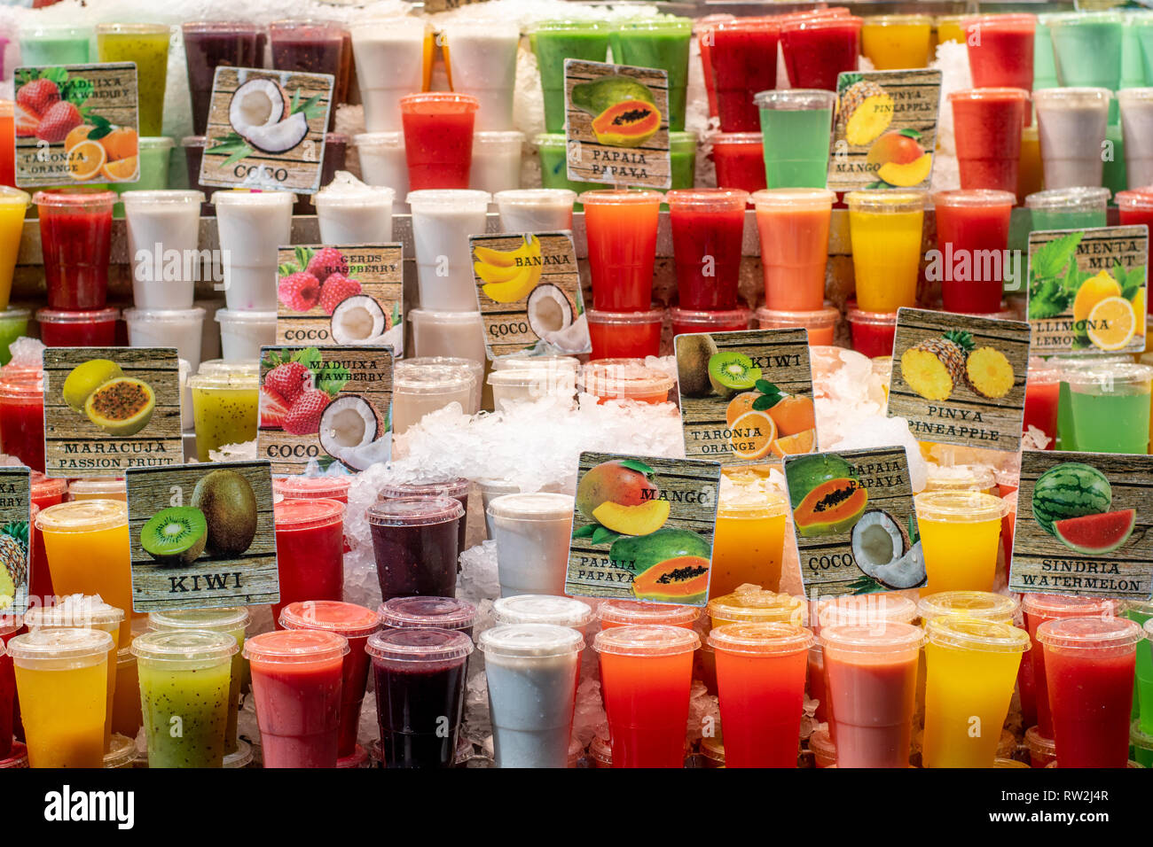 Fresh fruit juices on a stand in La Boqueria Food Market in Barcelona