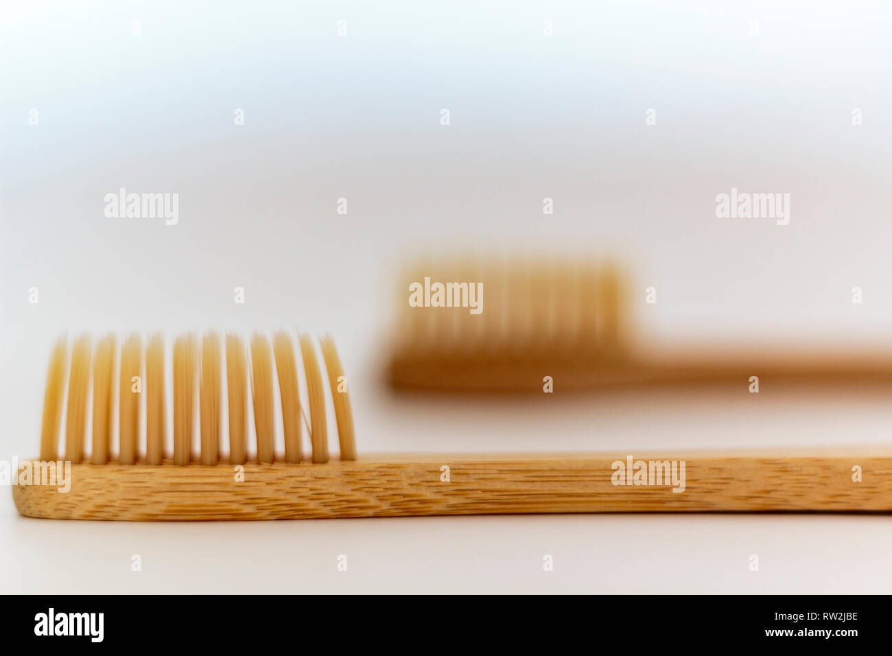 Eco Bamboo toothbrushes on white background Stock Photo - Alamy